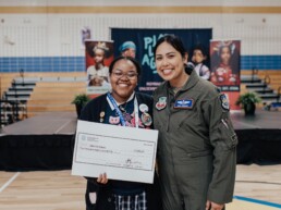 Young girl receiving a scholarship check